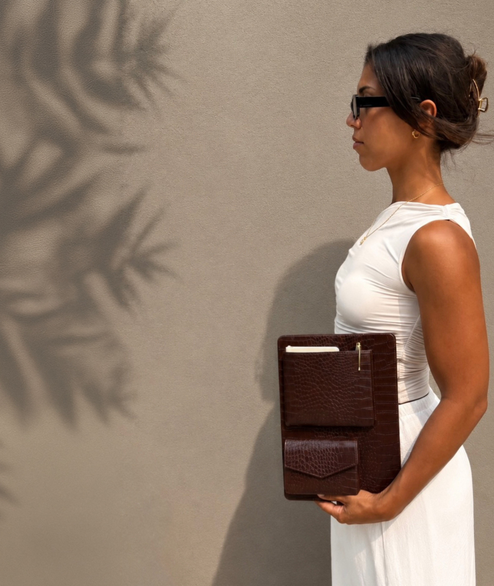 woman holding wesbury collection macbook case