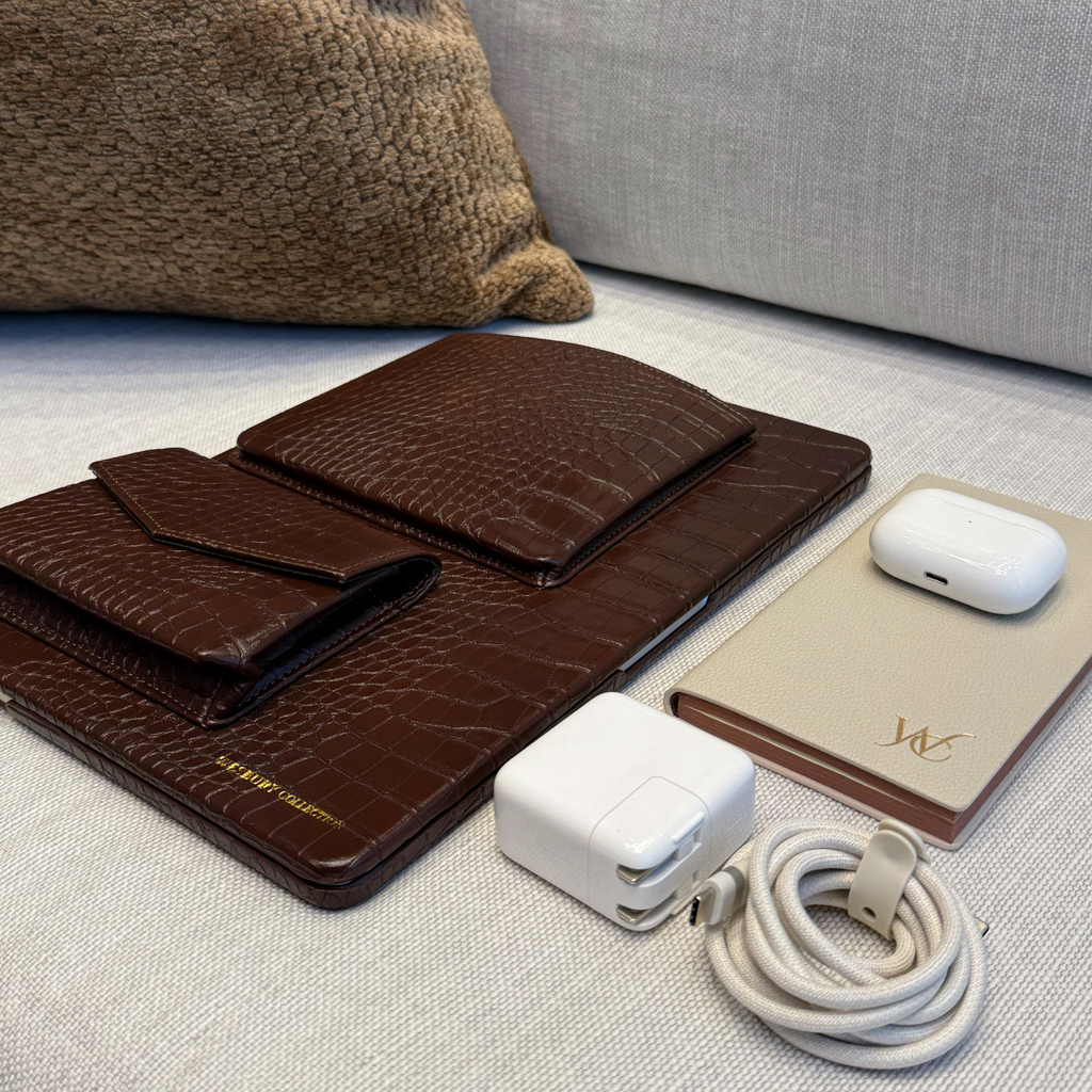 wesbury macbook case on a couch with essentials
